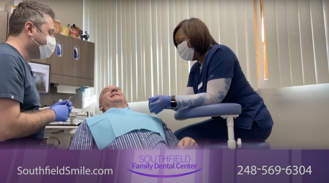 Dentist treating his patient