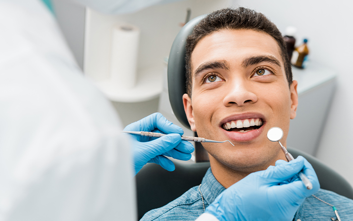 Dentist preparing to treat a patient's teeth