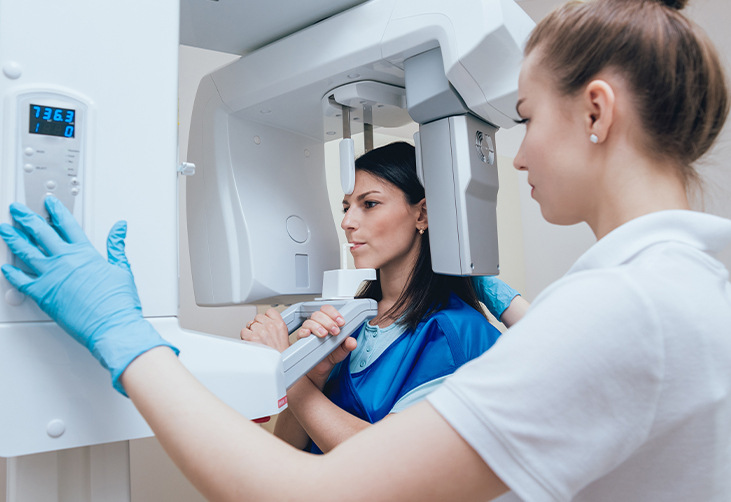 Dentist taking an x-ray of a patient's teeth