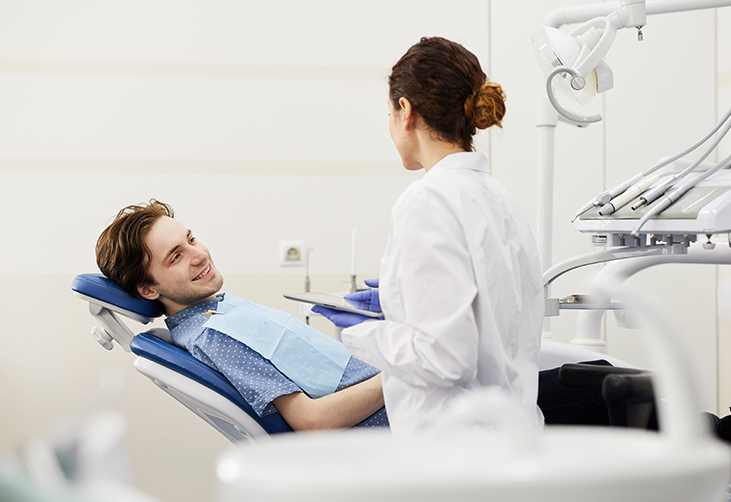 Dentist discussing a patient's teeth whitening options